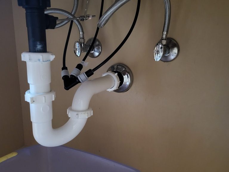 Under-sink fixture plumbing Under-sink P-trap, supply hoses and shutoff valves