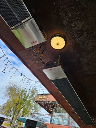 Patio ceiling equipment Two ceiling-mounted heaters beneath a patio roof