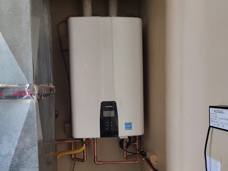 Wall-mounted tankless water heater with connected water and gas piping