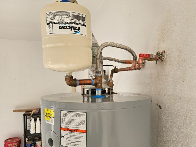 Storage water heater project photograph Storage water heater with an expansion tank and connected plumbing