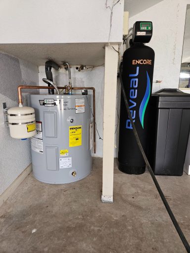 Water heater and conditioner Storage water heater beside an Encore Reveal water conditioner