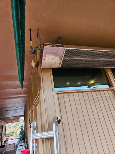 Patio heater detail Wall and ceiling area beside a mounted patio heater
